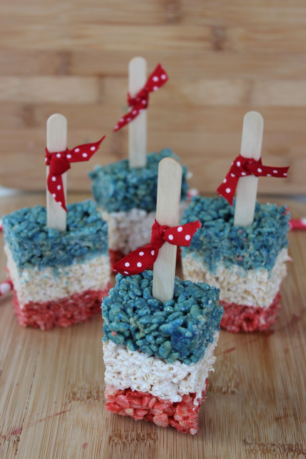 We've found 15 of the Best 4th of July Rice Krispie Treats.  Your friends and family at your Fourth of July party or summer family BBQ will love these Red White and Blue treats! These 15 yummy Patriotic Desserts are all amazing and gorgeous 4th of July treats.  Pin these easy to make Independence Day Rice Krispie Treats for later and follow us for more 4th of July Food Ideas. 