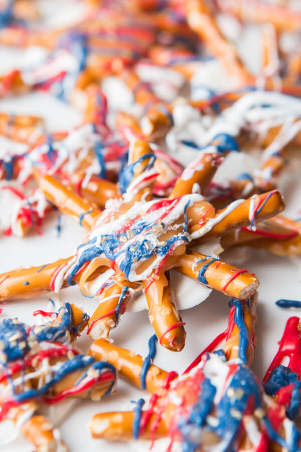 We've found 15 of the Best 4th of July Pretzels and they are sweet, salty, delicious and red, white and blue! They'd be perfect 4th of July dessert for your Fourth of July party or summer family BBQ! These 15 yummy Patriotic Pretzel Snacks will be a delicious 4th of July treat.  Pin these easy to make Independence Day desserts for later and follow us for more 4th of July Food Ideas. 